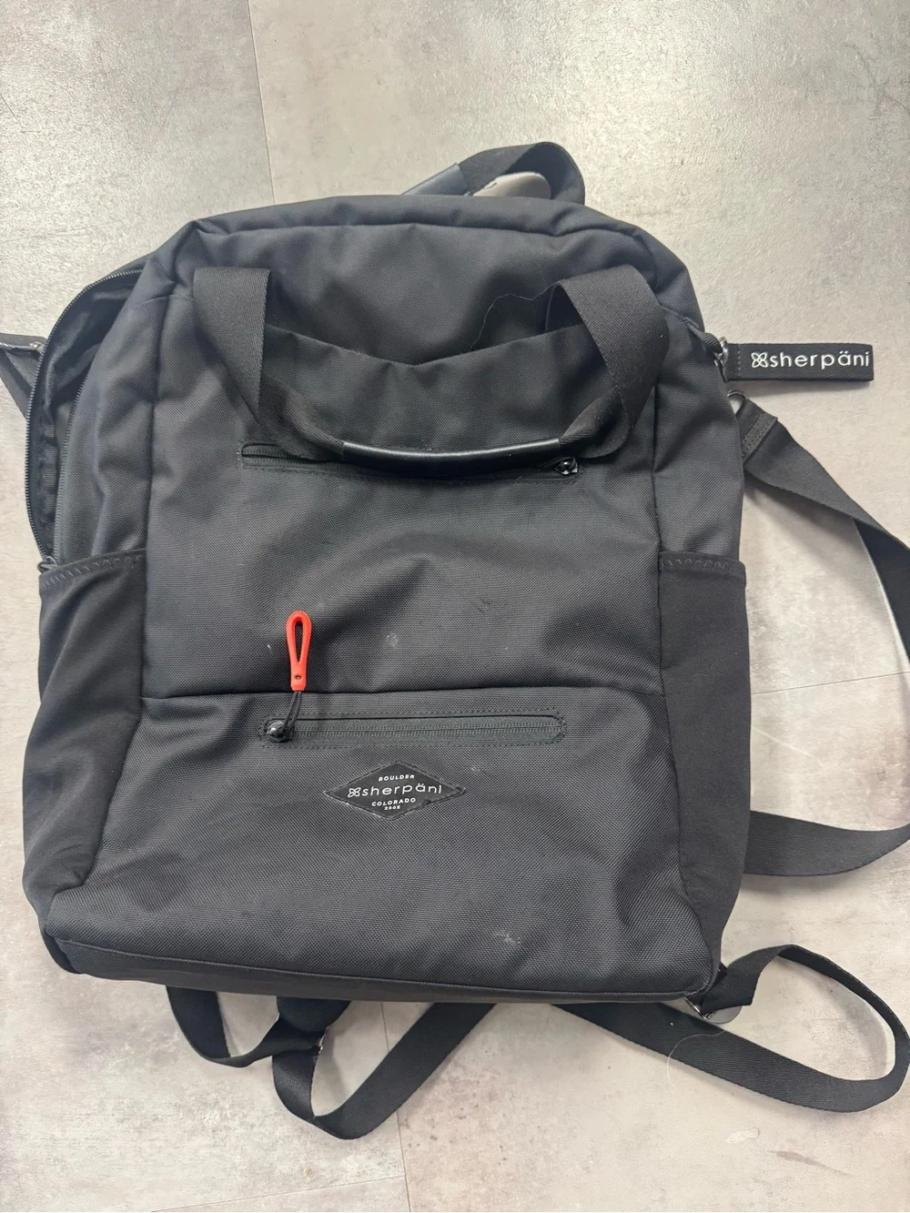 Sherpani Black Backpack with Red Zipper Pull